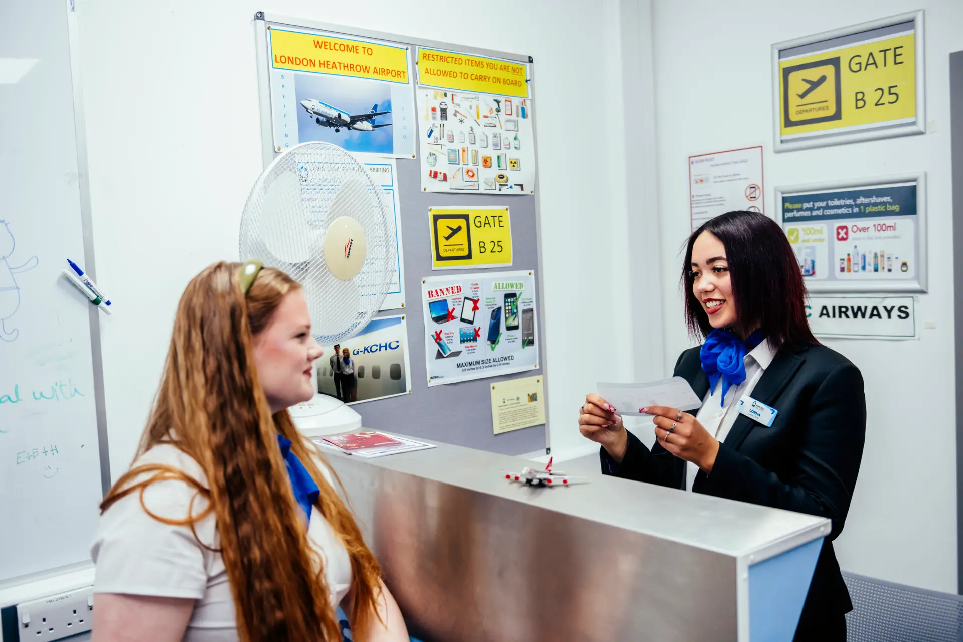 Students check in desk role play