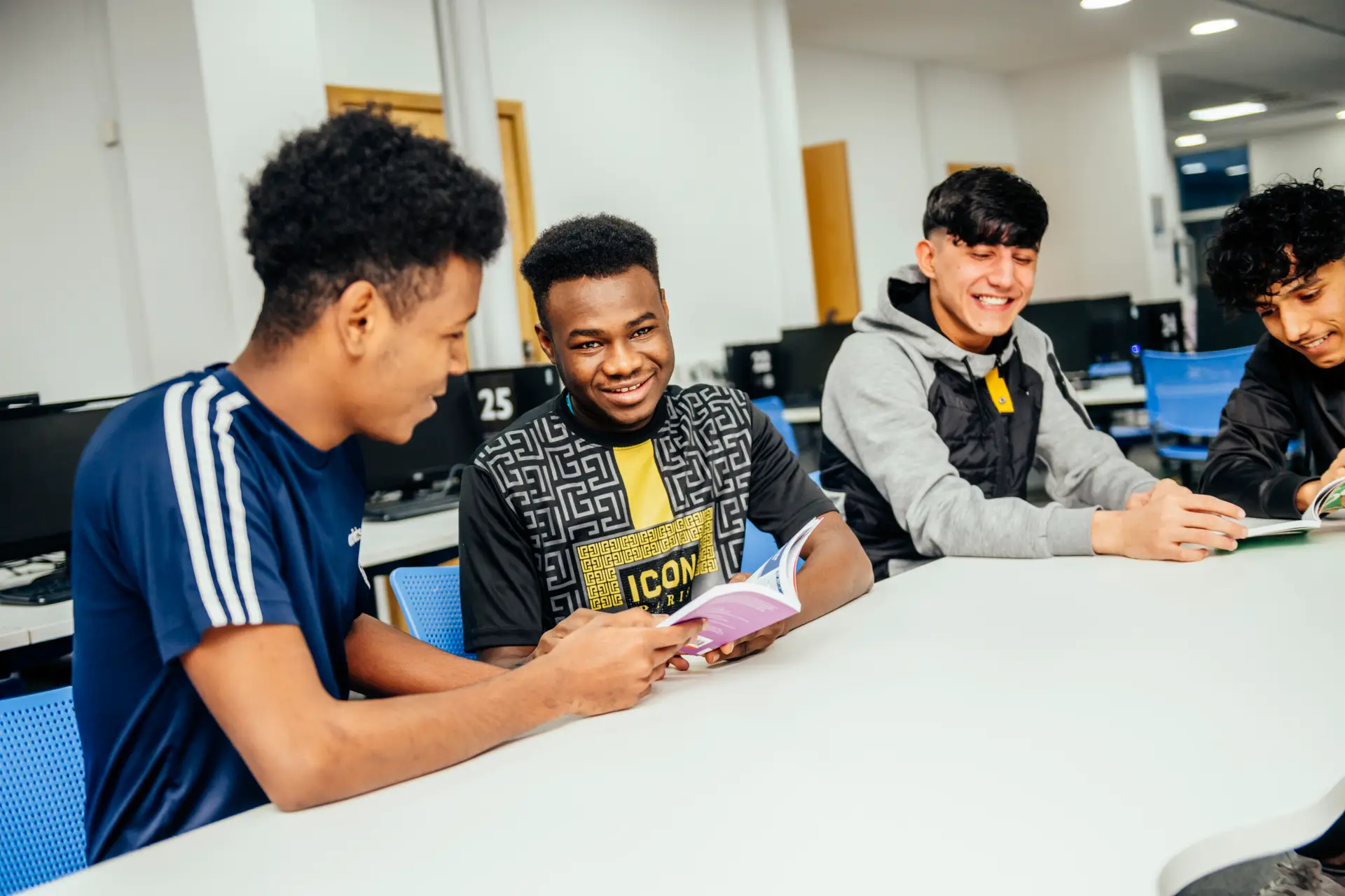 Students reading and laughing together