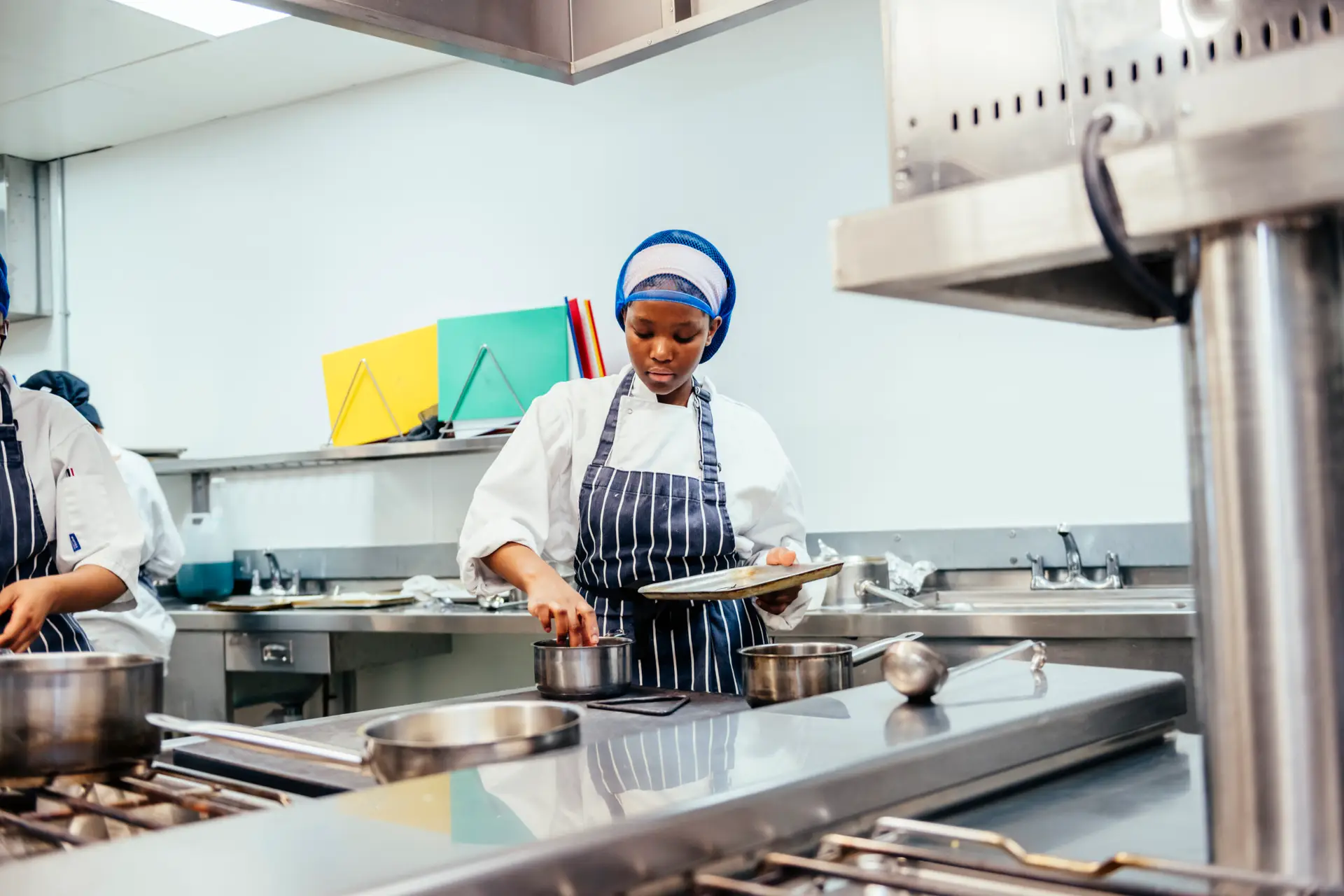 Student working in the kitchen.