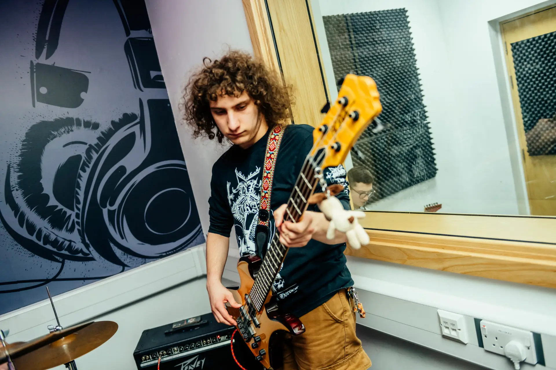 Student playing a guitar