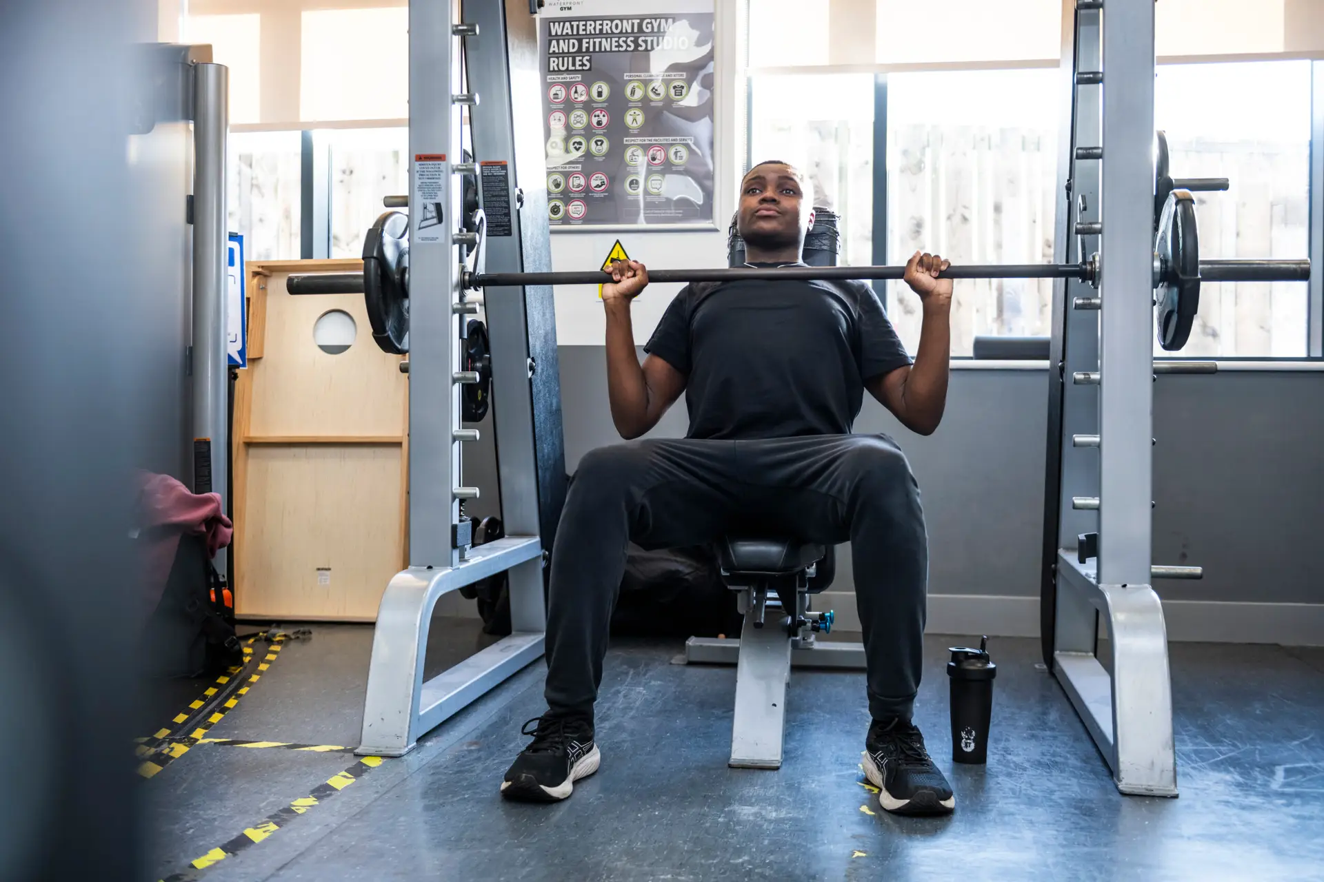 Student lifting weights