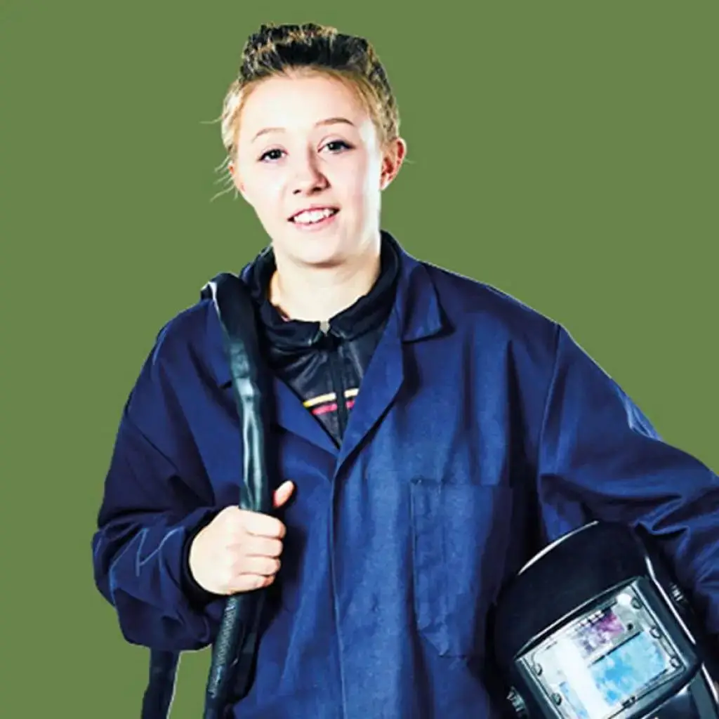 A young woman in a blue lab coat holding a welding torch and helmet, smiling confidently against a green background. Represents vocational training in welding.