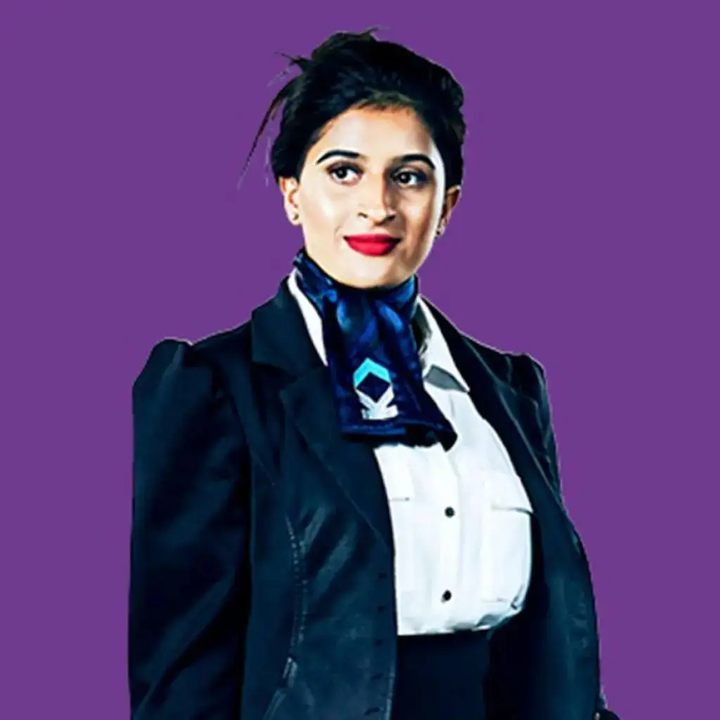 A woman in a flight attendant uniform stands confidently against a purple background, symbolising professionalism and education in aviation services.