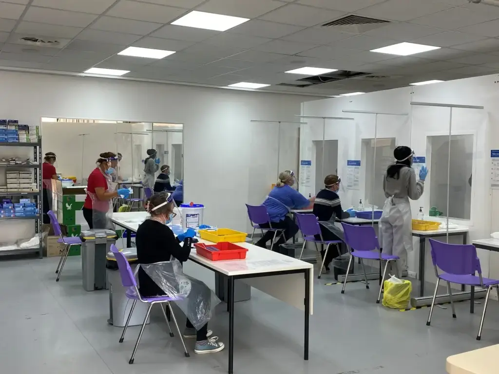 People waiting outside a COVID-19 testing centre for coronavirus testing.