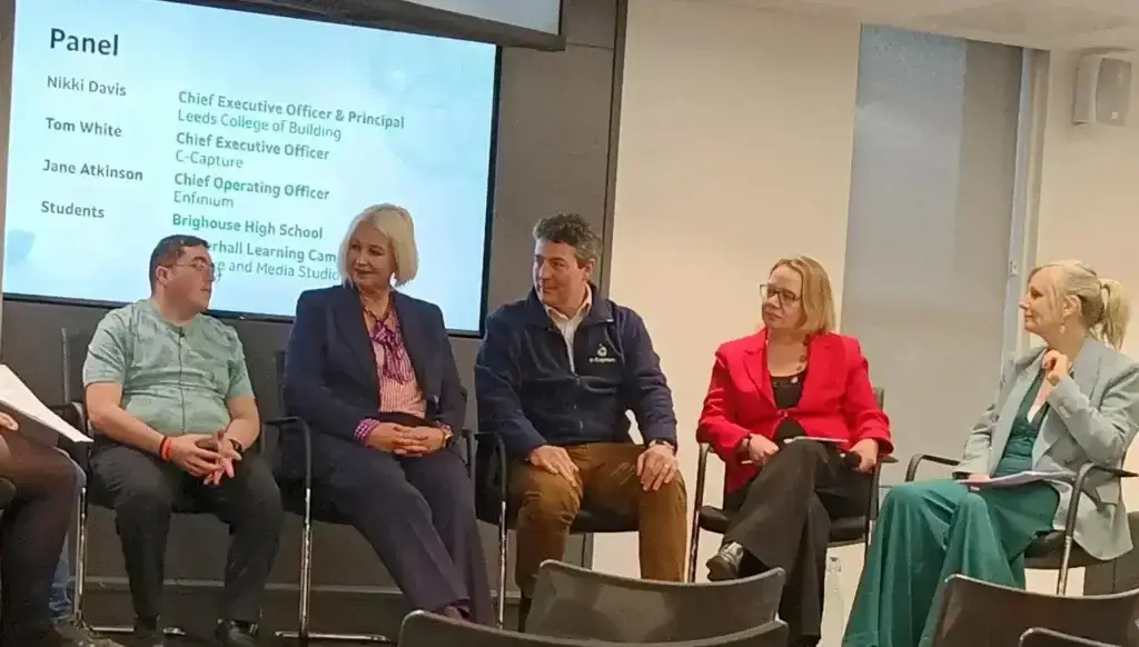 Five people from the Green Taskforce sit on stage