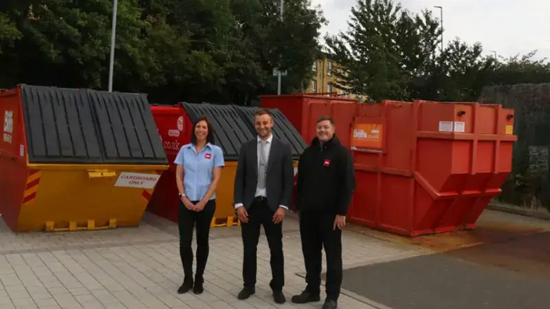 team checking garbage trucks