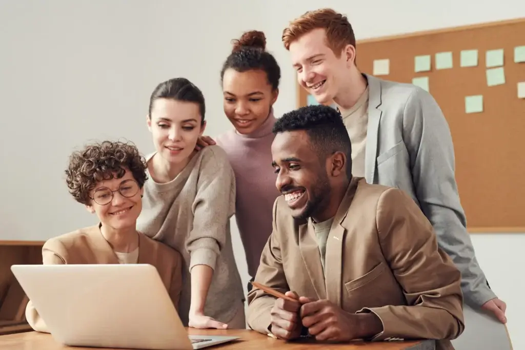 students looking in laptop screen