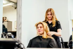 Hairdresser with customer