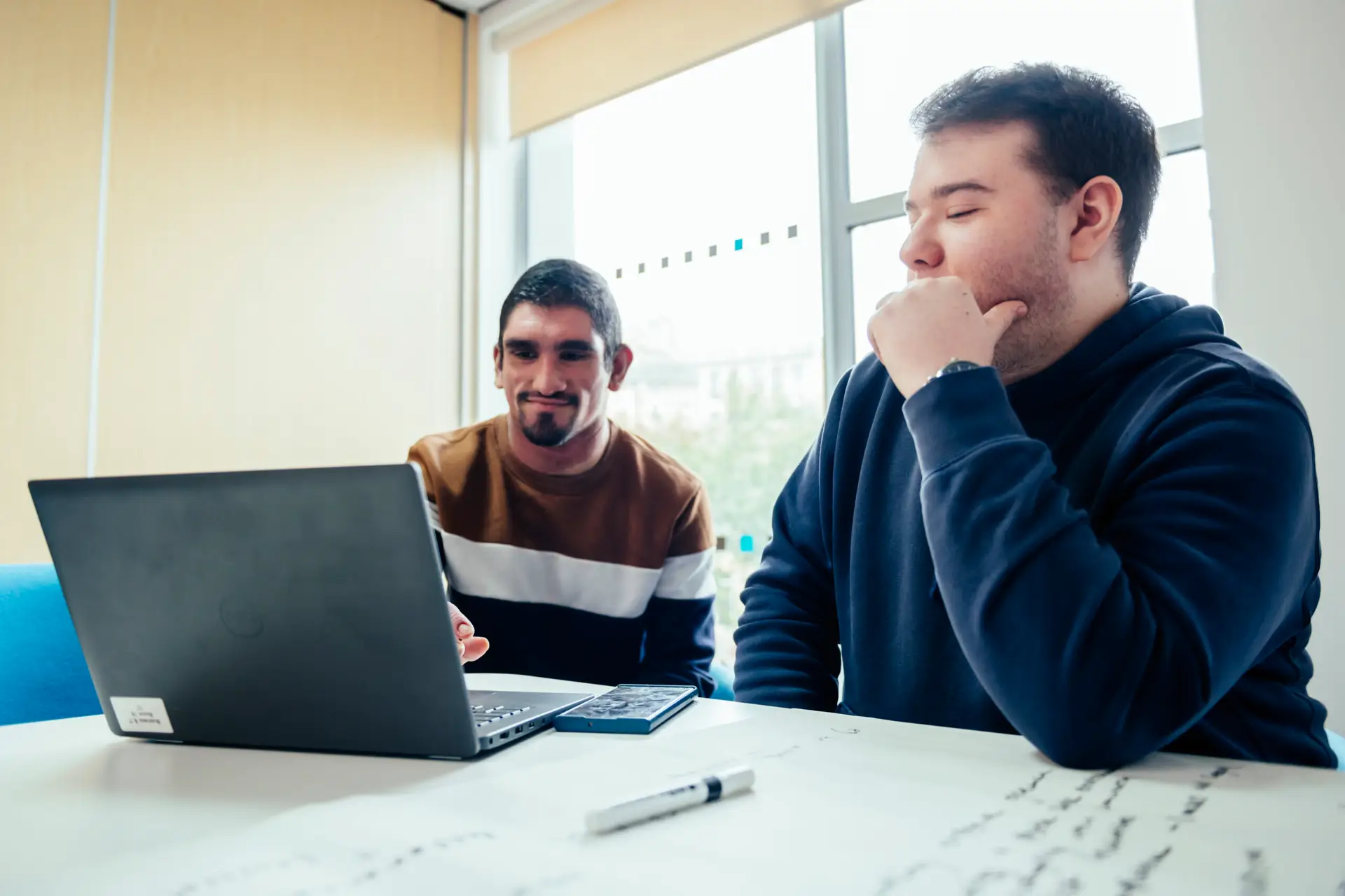 Students working at laptop