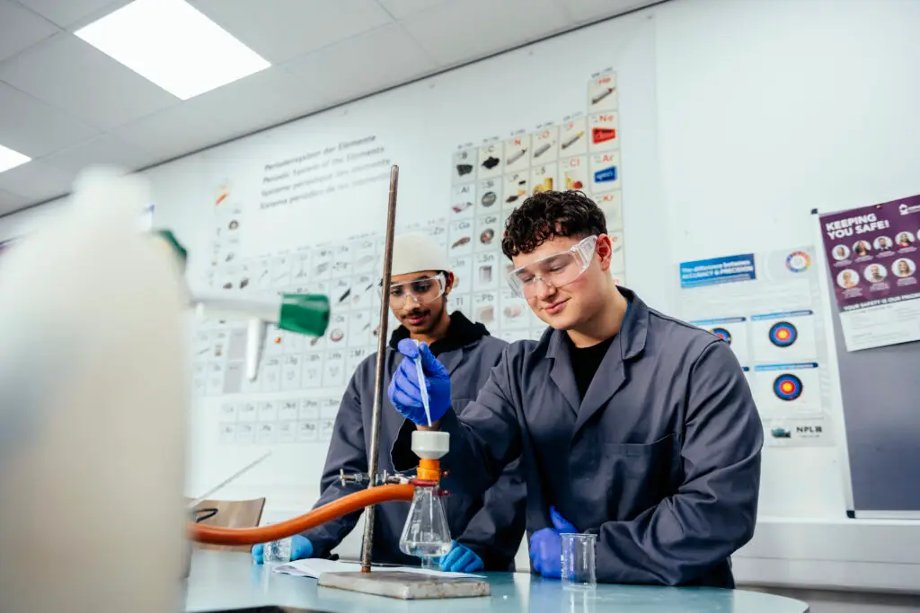 Two boys as laboratory technicians