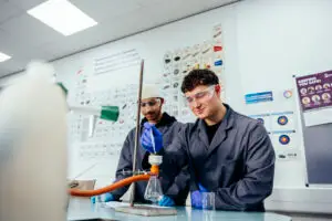 Two boys as laboratory technicians