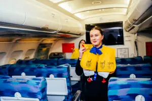 a girl cabin crew with life jacket on