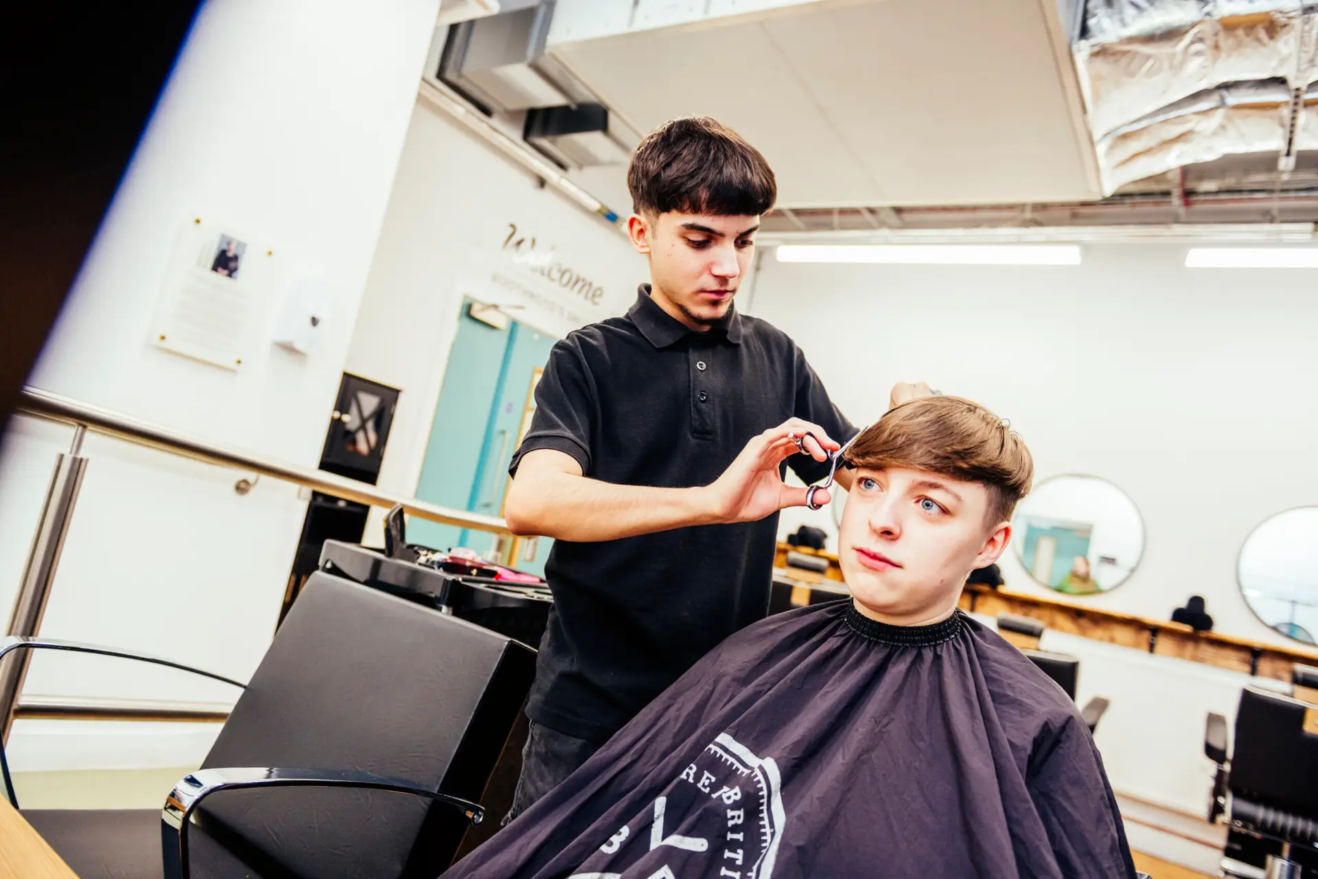 Barbering student with black t-shirt