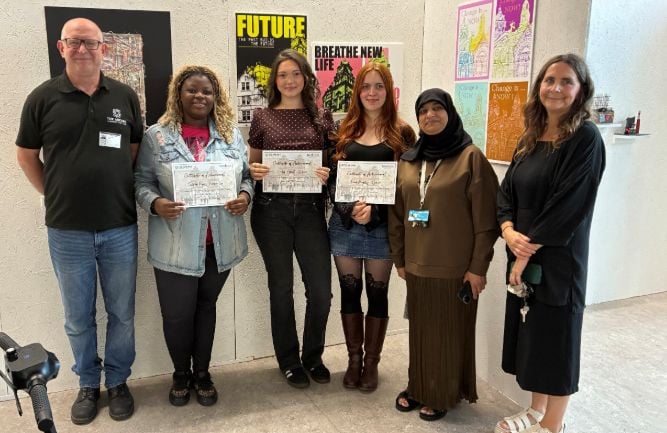 students and staff at art exhibition