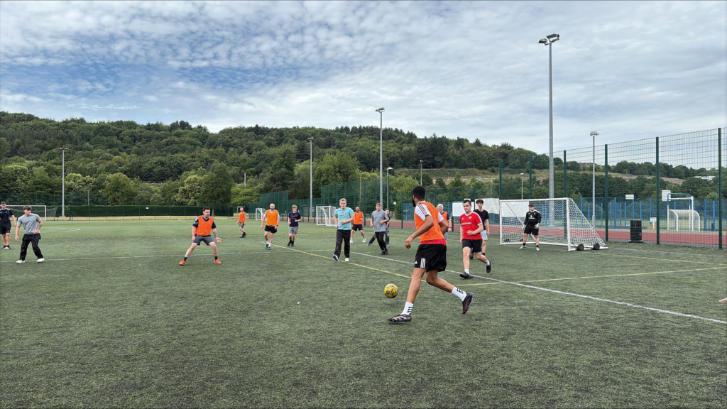 staff and students playing football