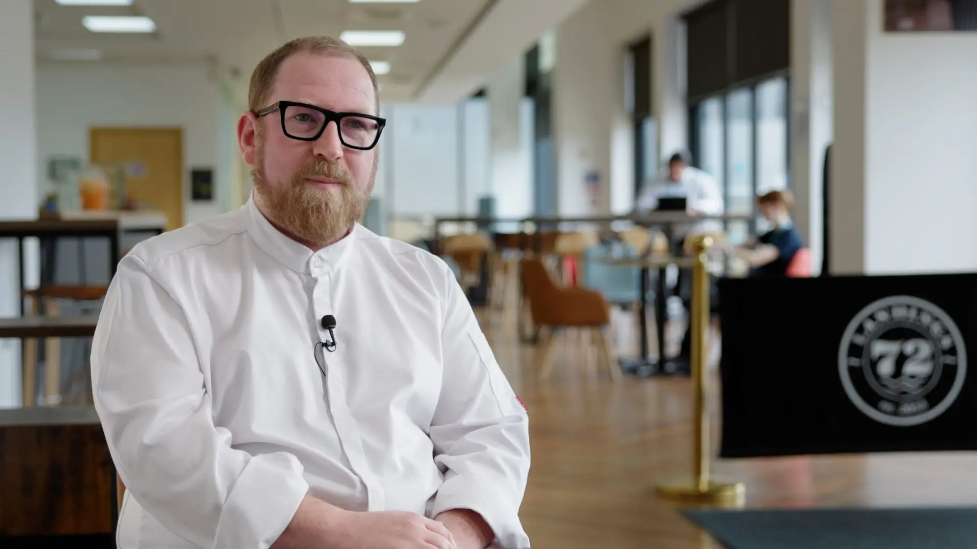 benjamiin atkinson talks to camera
