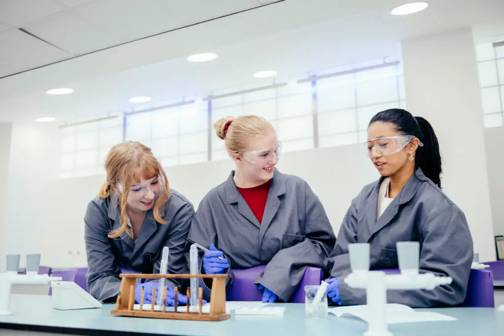 science students with grey lab coats
